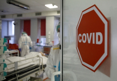 Too soon to treat COVID-19 like flu as Omicron spreads - WHO